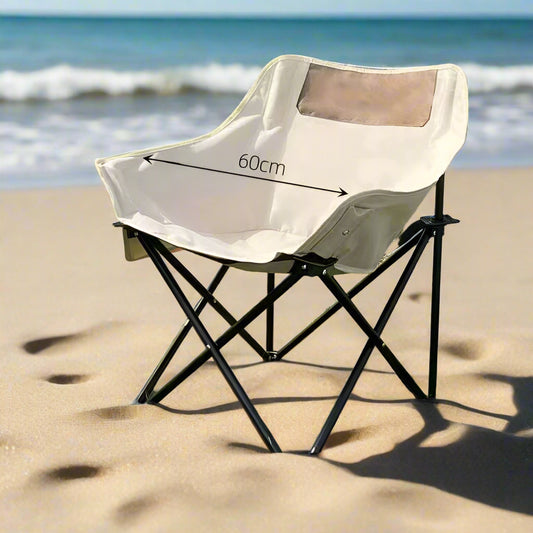Foldable camping chair with dimensions on a grassy background